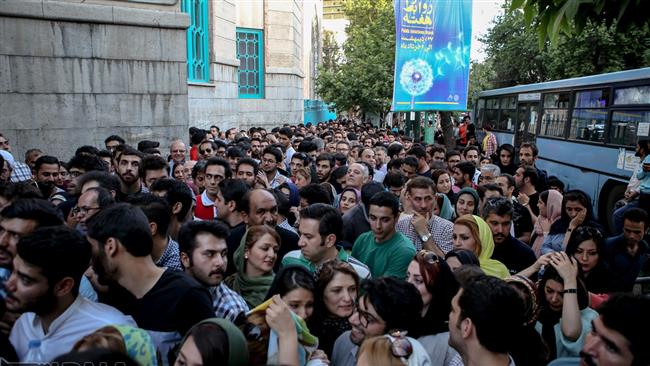 Iranian voters gather outside a polling station in the capital Tehran on May 19, 2017. (Photo by IRNA)
