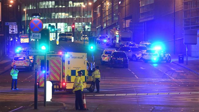 Emergency response vehicles are parked at the scene of a terrorist attack during a pop concert in Manchester, northwest England, May 23, 2017. (Photo by AFP)
