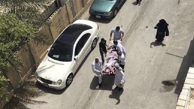 This image provided by an activist who requested to remain unnamed shows people carrying a man who was injured in a raid on a sit-in in Diraz, Bahrain, May 23, 2017. (Photo by AP)

