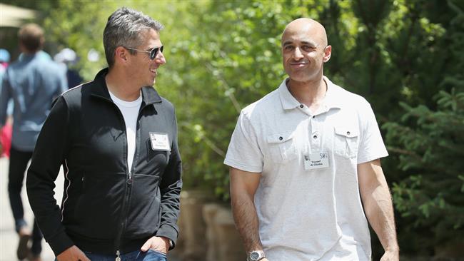 In this July 9, 2015 photo, Casey Wasserman (L), the chief executive officer of Wasserman Media Group, chats with Yousef Al-Otaiba, United Arab Emirates