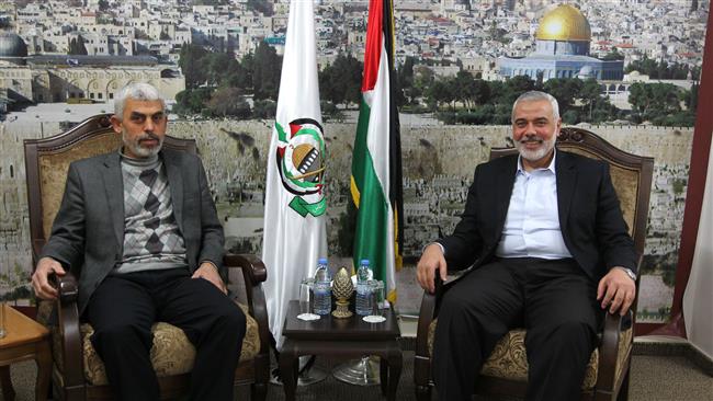 A handout picture released on February 21, 2017 by the office of the new chairman of Hamas political bureau, Ismail Haniyeh, shows him (R) meeting with the newly chosen leader in Gaza, Yehiya Sinwar, in Gaza City. (Photo by AFP)
