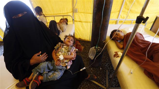 Yemeni children suspected of being infected with cholera receive treatment at a makeshift hospital in Sana