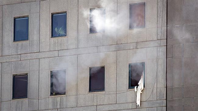 Smoke is seen during a terrorist attack on the Iranian Parliament’s building in central Tehran on June 7, 2017. (Photo by Tasnim news agency)
