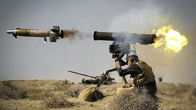 The file photo shows a serviceman launching a rocket during military maneuvers by the Ground Forces of Iran’s Islamic Revolution Guards Corps.
