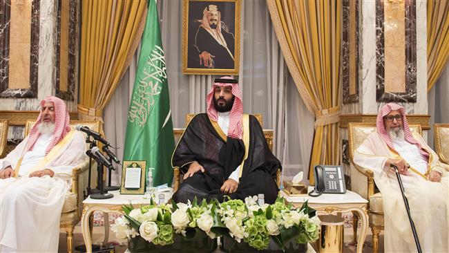 This handout photo made available by the Saudi Press Agency (SPA) on June 21, 2017 shows Saudi Crown Prince Mohammed bin Salman Al Saud (C) sitting as royal family members and other officials pledge allegiance to him at the Royal Palace in Mecca. (Photo by AFP)