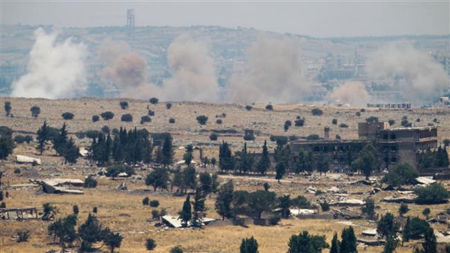 A picture taken from the Israeli-occupied Golan Heights shows smoke billowing from the Syrian side of the border on June 25, 2017. (Photo by AFP)
