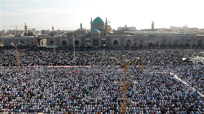 Worshipers participate in Eid al-Fitr prayers at the Imam Reza shrine in Iran
