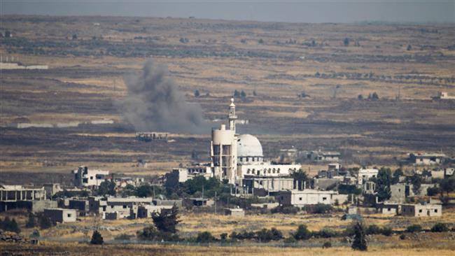 A picture taken from the Israeli-occupied Golan Heights shows smoke billowing from the Syrian side of the border on June 25, 2017. (Photo by AFP)
