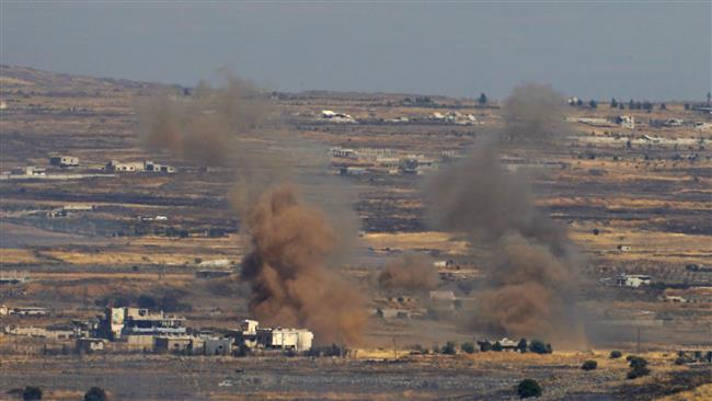 A picture taken from the Israeli-occupied Golan Heights shows smoke billowing from the Syrian side of the border on June 25, 2017. (Photo by AFP)
