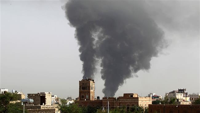 This file photo, taken on July 7, 2015, shows smoke billowing following airstrikes by a Saudi-led coalition on the Yemeni capital, Sana’a. (By AFP)
