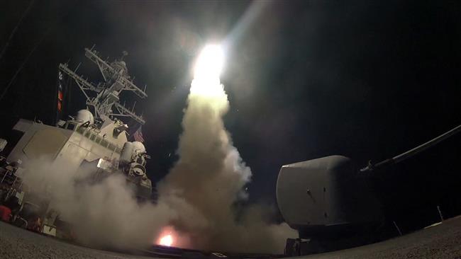 In this image provided by the US Navy, the guided-missile destroyer USS Porter (DDG 78) launches a Tomahawk missile attack against Syria from the Mediterranean Sea on April 7, 2017. (Via AP)
