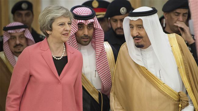 The handout picture provided by the Saudi Royal Palace on April 5, 2017 shows Saudi King Salman bin Abdulaziz Al Saud (R) receiving British Prime Minister Theresa May (L) in Riyadh. (Via AFP)
