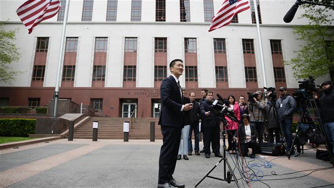 This photo taken on May 15, 2017 shows Hawaiian Attorney General Douglas speaking to reporters outside US Court of Appeals in Seattle, Washington. (Photo by AFP)
