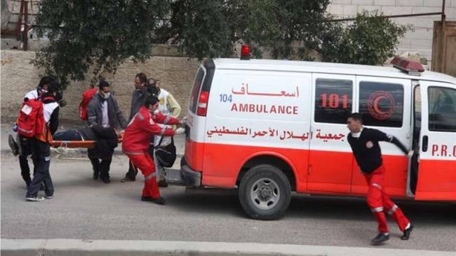 This file photo shows Palestinian medics and a Palestinian Red Crescent Society ambulance in the occupied West Bank.
