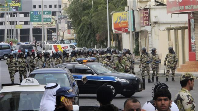 Saudi riot police forces are stationed in the streets of Qatif Governorate during an anti-government protest on March 11, 2011. (Photo by AP)
