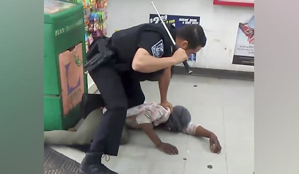 US police officer filmed beating black woman with baton