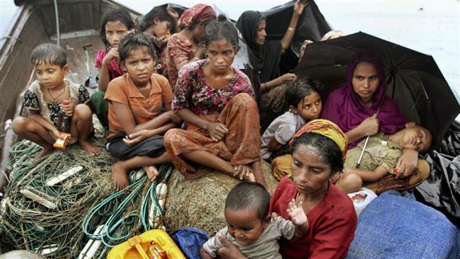 Rohingya Muslims flee to Bangladesh to escape ongoing violence against them in Myanmar. (Photo by AP)
