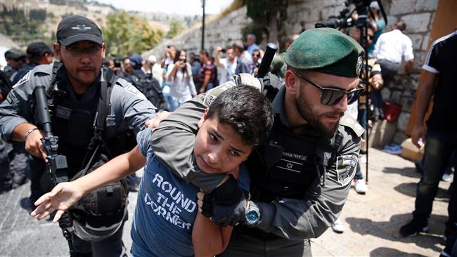 Israeli border guards detain a Palestinian teenager during a demonstration outside the Lions’ Gate, a main entrance to the al-Aqsa Mosque compound, due to newly-implemented security measures by Israeli authorities which include metal detectors and cameras, in the Old City of occupied Jerusalem al-Quds on July 17, 2017. (Photo by AFP)
