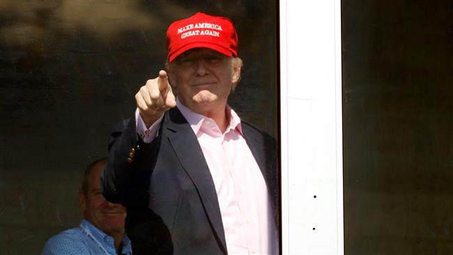 US President Donald Trump points to supporters at the US Women