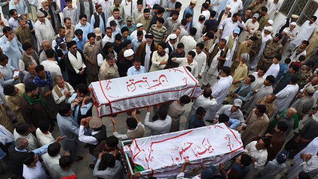 Pakistani mourners carry the coffins of Shia Muslims who were killed in an ambush by gunmen during their funeral in Quetta on July 19, 2017. (Photo by AFP)