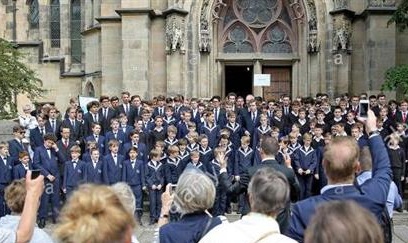 The Wuerzburger Domsingknaben choir, the Regensburger Domspatzen choir, and the Thomanerchor Leipzig choir sing at Catholics Day for those who don