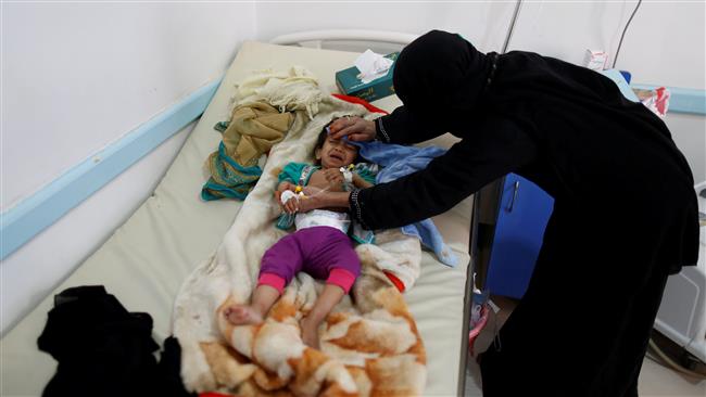 A woman takes care of her son at a cholera treatment center in Yemen’s capital city of Sana’a on June 6, 2017. (Photo by Reuters)
