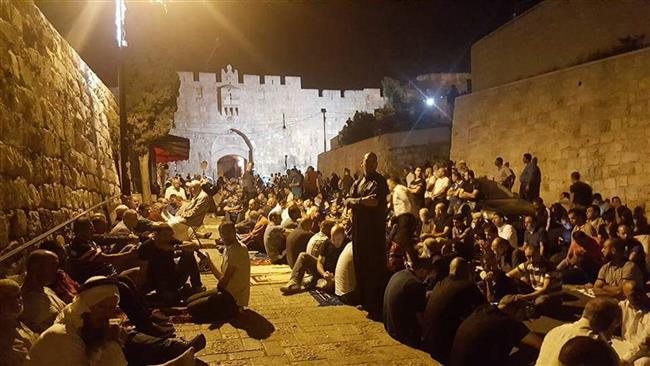 Picture shows Palestinians saying their prayers at Bab al-Asbat (Lions’ Gate) to Jerusalem al-Quds’ Old City, July 20, 2017.
