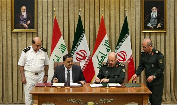 Iranian Defense Minister Brigadier General Hossein Dehqan (2nd R) and his Iraqi counterpart, Erfan al-Hiyali (2nd L), sign a memorandum of understanding to boost defense and military cooperation in Tehran on July 23, 2017. (Photo by mod.gov.ir)