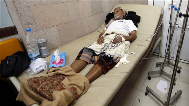 A Yemeni man suspected of being infected with cholera receives treatment at a makeshift hospital in Sana’a on July 13, 2017. (Photo by AFP)