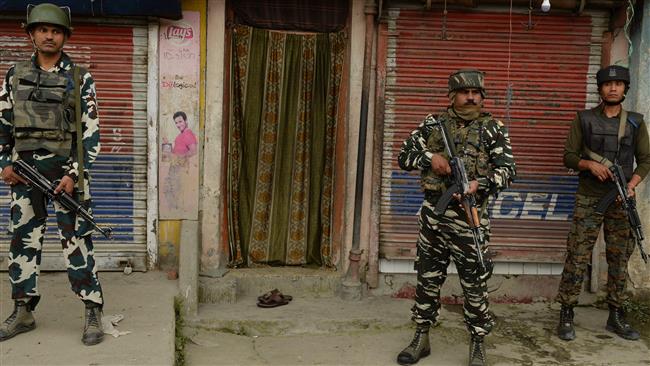 Indian forces stand guard in the Batengoo area of Anantnag, south of Srinagar, on July 11, 2017. (Photo by AFP)