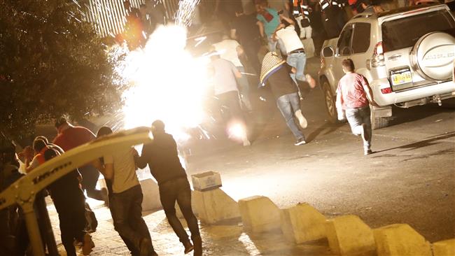 Palestinian worshippers run for cover as Israeli forces fire to disperse crowds of demonstrators outside Lions