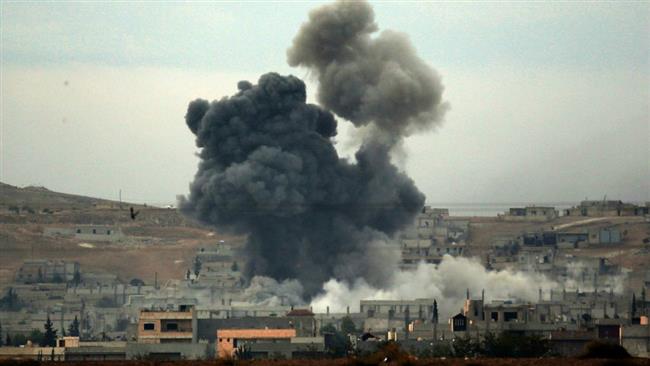 In this file photo, thick smoke rises following an airstrike by the US-led coalition in Kobani, Syria, against purported positions of Daesh terrorists. (Photo by AP)