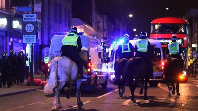 Video posted to social media showed riot police and officers on horseback trying to break up groups of protesters. (Photo by the Press Association)
