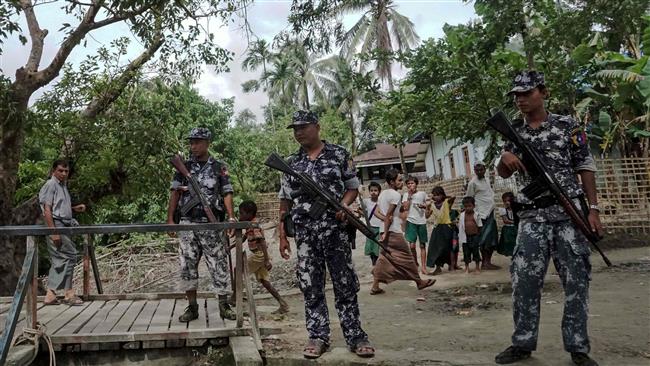 This photo, taken on July 13, 2017, shows border police at Ngayantchaung Village, in the Buthidaung township in Myanmar