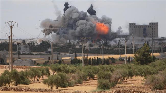 Smoke and flame rise after what fighters of the so-called Syria Democratic Forces said were US-led air strikes on Manbij city, Aleppo Province, northern Syria. (Photo by Reuters)