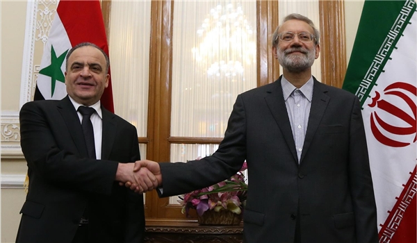 Larijani at a meeting with Syrian Prime Minister Imad Khamis.