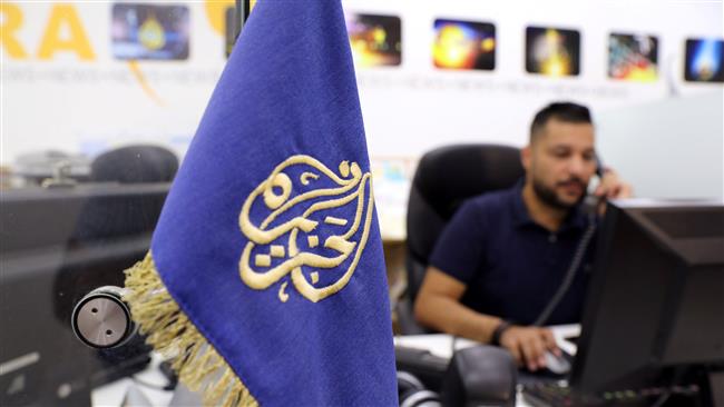 An employee of the Qatar-based news network and TV channel Al Jazeera works at the channel