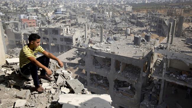The photo taken on August 6, 2014 shows a Palestinian man looking out over destruction caused by the Israeli war in part of Gaza City