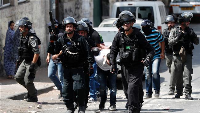 Israeli forces detain a Palestinian protester during clashes after border guards dispersed Muslim worshipers with teargas following prayers outside Jerusalem al-Quds’ Old City, which houses the al-Aqsa Mosque’s compound, on July 21, 2017. (Photo by AFP)
