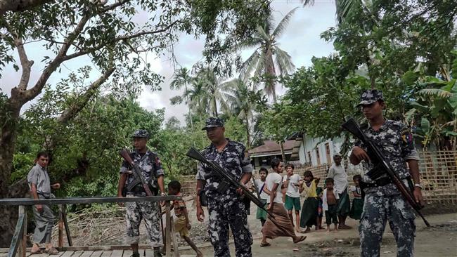 This photo taken on July 13, 2017 shows border police at Ngayantchaung village, Buthidaung township in Myanmar. (Photo by AFP)
