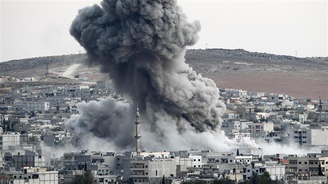 In this file photo, smoke rises following an airstrike by US-led coalition aircraft in Kobani, Syria, during fighting between Syrian Kurds and Daesh terrorists. (Photo by Getty Images)