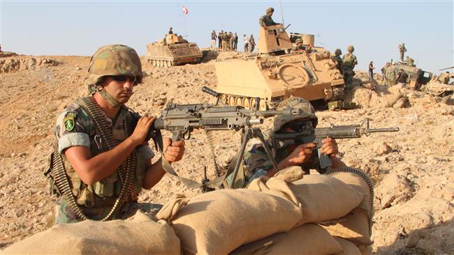 Picture taken on August 17, 2017, during a tour guided by the Lebanese Army, shows soldiers holding a position in a mountainous area near the eastern village of Ras Baalbek during an operation against terrorists. (Via AFP)
