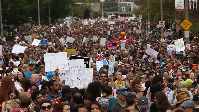 Thousands of protesters prepare to march in Boston against a planned "Free Speech Rally" just one week after the violent 