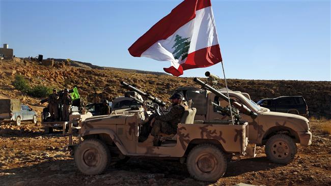 This Saturday, July 29, 2017 photo, shows Hezbollah fighters sitting on their army vehicle at the site where clashes erupted between Hezbollah and al-Qaida-linked militants near the Lebanon-Syria border. (Photo by AP)
