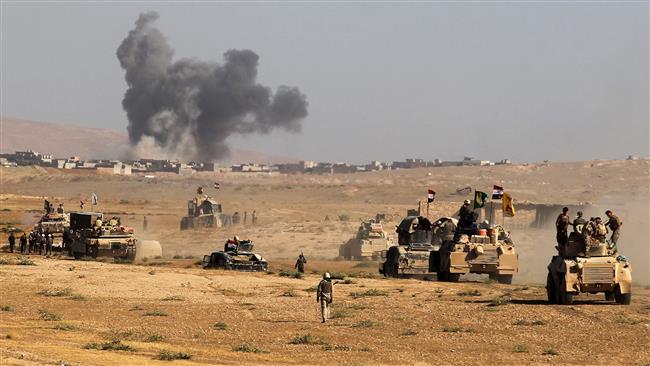 Iraqi forces, backed by Popular Mobilization Units (Hashd al-Shaabi), advance towards the city of Tal Afar, west of Mosul, after the Iraqi government announced the beginning of the operation to retake it from the control of Daesh Takfiri terrorists on August 22, 2017. (Photo by AFP)
