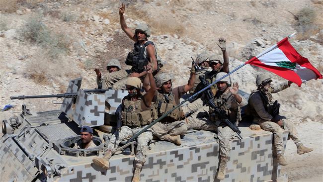 Lebanese army forces sit on their military vehicles in the Lebanese town of Ras Baalbek on August 21, 2017. (Photo by Reuters)
