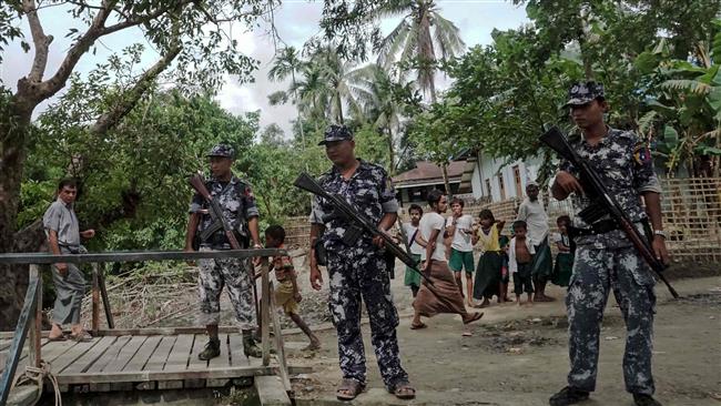 Mynamar border police stand guard at Ngayantchaung village on July 13, 2017. (Photo by AFP)
