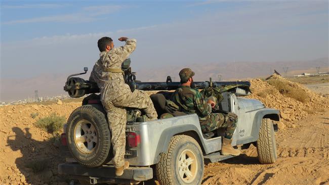 Syrian forces hold a position in Jurud al-Qaa mountainous border area in western Qalamoun, on August 19, 2017, during an offensive against Daesh Takfiri terrorists. (Photo by AFP)
