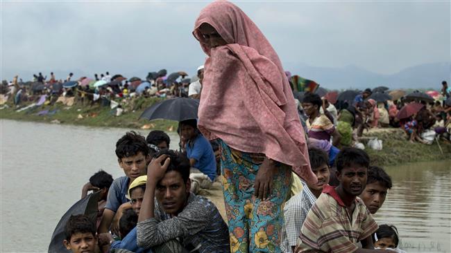 Displaced Rohingya refugees from Rakhine State in Myanmar rest near the border between Bangladesh and Myanmar on September 4, 2017. (Photo by AFP)
