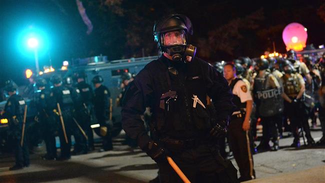 St. Louis police stand guard during a proteston September 15, 2017. (Photo by AFP)
